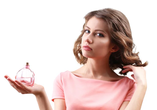 Hermosa mujer con frasco de perfume aislado en blanco — Foto de Stock