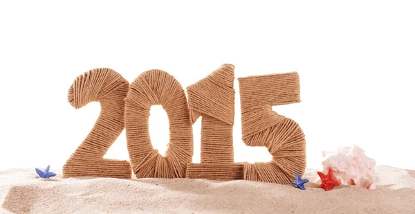 2015 tecken på stranden sand — Stockfoto