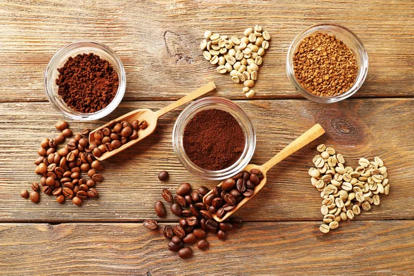 Various of coffee in small dishes on wooden table, top view — Stock Photo, Image