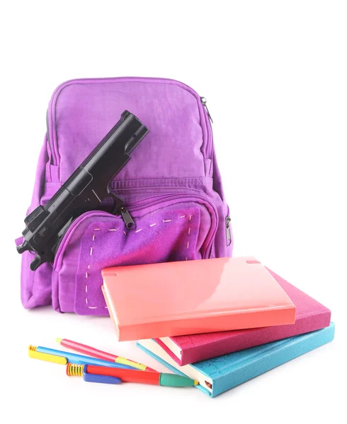 Gun in school backpack, isolated on white — Stock Photo, Image