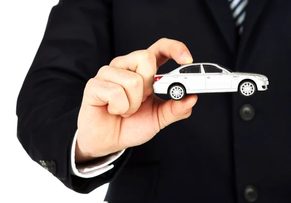 Man holding model of car in his hand — Stock Photo, Image