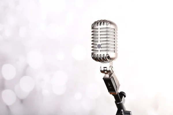 Retro microphone on bright blurred background — Stock Photo, Image