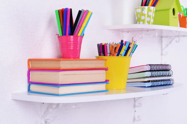 Shelves with stationery in child room — Stock Photo, Image