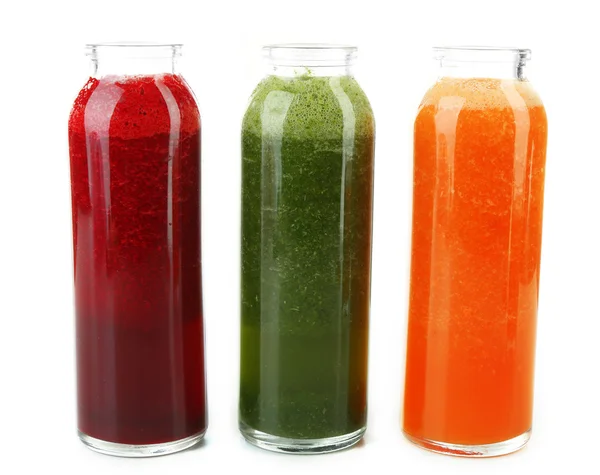 Assortment of healthy fresh juices in glass bottles, isolated on white — Stock Photo, Image