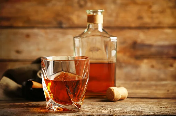 Whiskey on wooden background — Stock Photo, Image