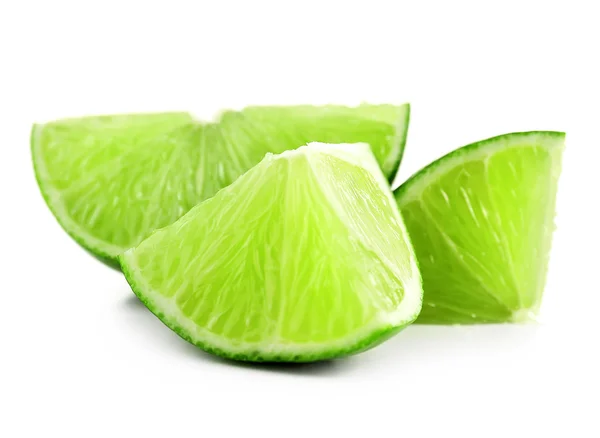 Juicy slices of lime isolated on white — Stock Photo, Image