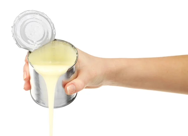 Female hand holding tin can of condensed milk isolated on white — Stock Photo, Image