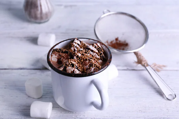 Mug of cocoa with marshmallow on wood background — Stok Foto