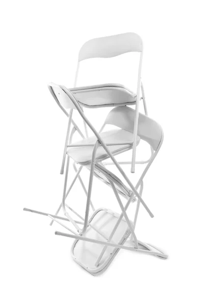 Pila de sillas de metal aisladas en blanco — Foto de Stock
