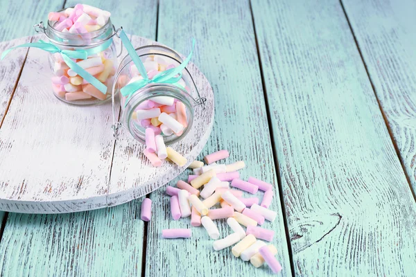 Sweet candies on color wooden table, closeup — Stock Photo, Image