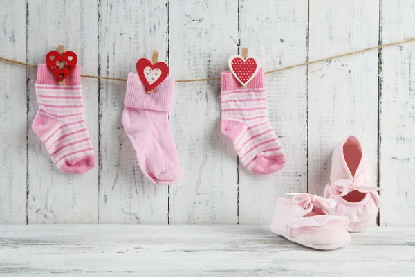 Cute toddler shoes on wooden background — Stock Photo, Image