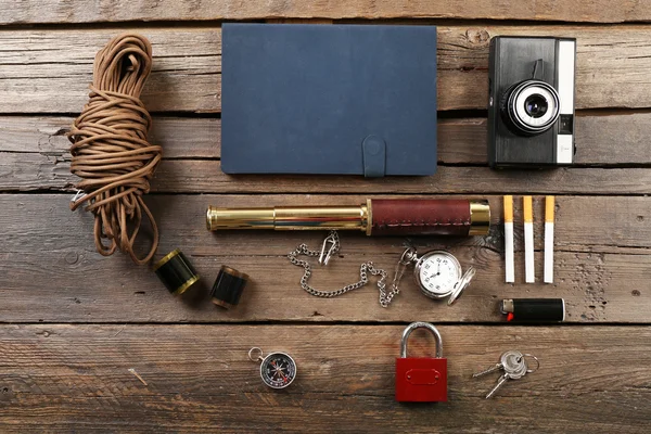 Hiking gear on wooden background — Stock Photo, Image