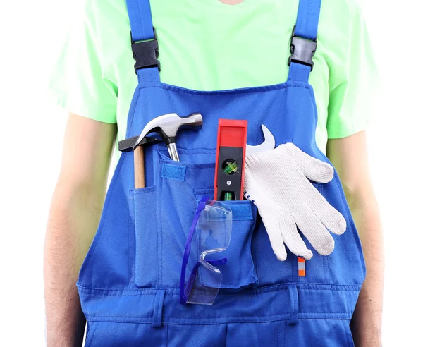 Man in overall met tools — Stockfoto