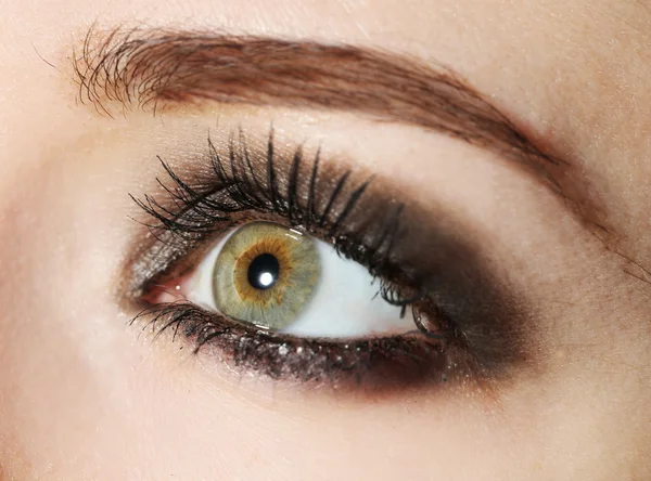 Eye of young woman with tear drop close up — Stock Photo, Image