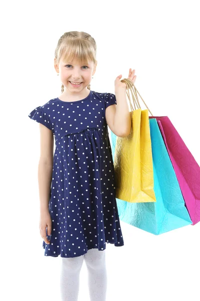 Śliczną dziewczynkę z torby na zakupy na białym tle — Zdjęcie stockowe