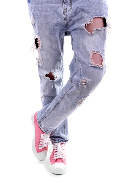 Person in torn jeans and pink sneakers isolated on white — Stock Photo, Image