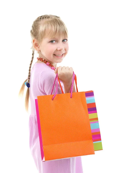 Hermosa niña con bolsas aisladas en blanco — Foto de Stock