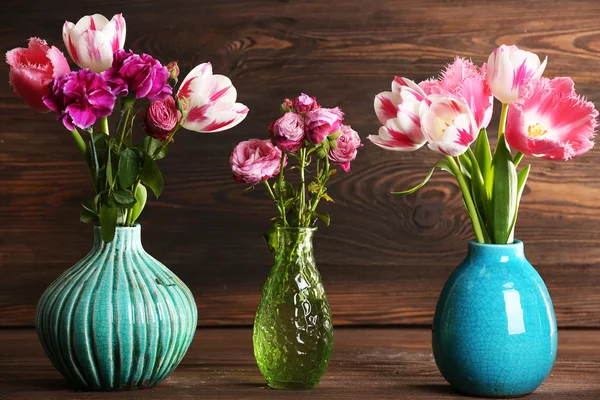 Flowers on wooden background — Stock Photo, Image