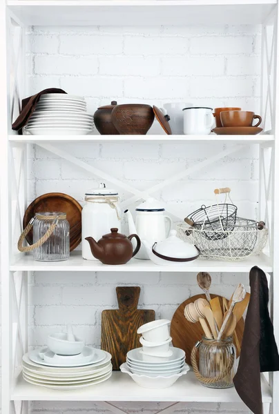 Kitchen shelving with dishes — Stock Photo, Image