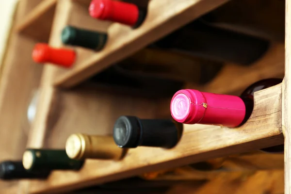 Shelving with wine bottles, closeup — Stock Photo, Image