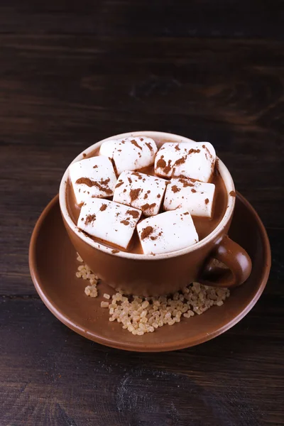 Cup of cocoa with marshmallows on wooden background Stock Picture