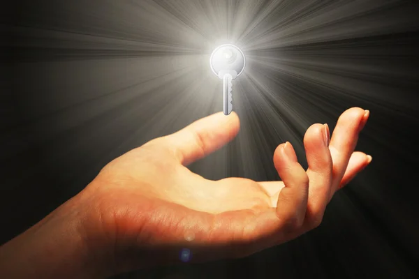 Female hand with key — Stock Photo, Image