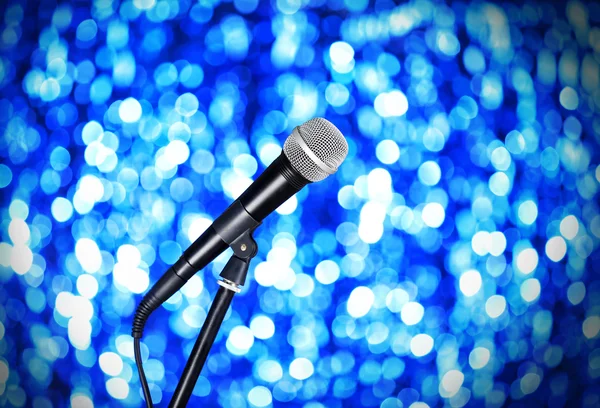 Microphone on stand on blue background — Stock Photo, Image