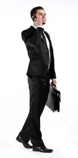 Homme élégant en costume avec téléphone portable et mallette isolée sur blanc — Photo