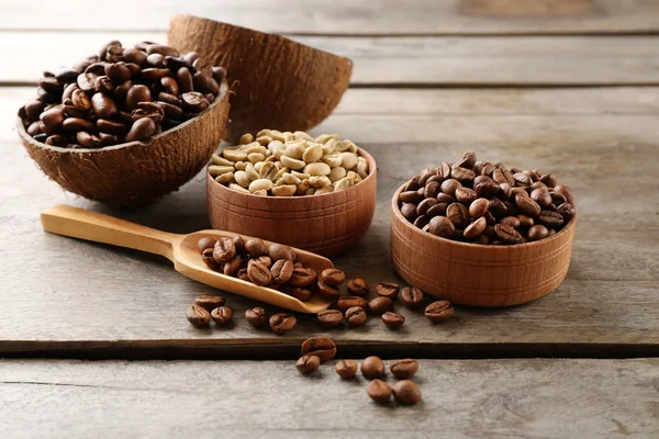 Various of coffee in small dishes on wooden background — Stock Photo, Image