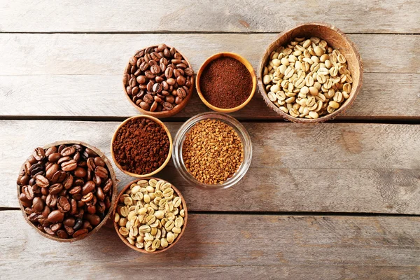 Various of coffee in small dishes on wooden table, top view — Stock Photo, Image