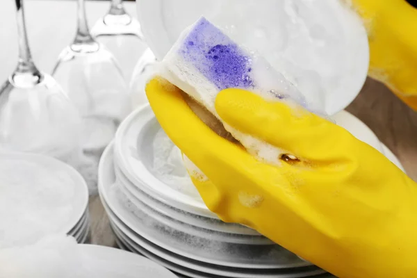 Female hand washing dish close up — Stock Photo, Image