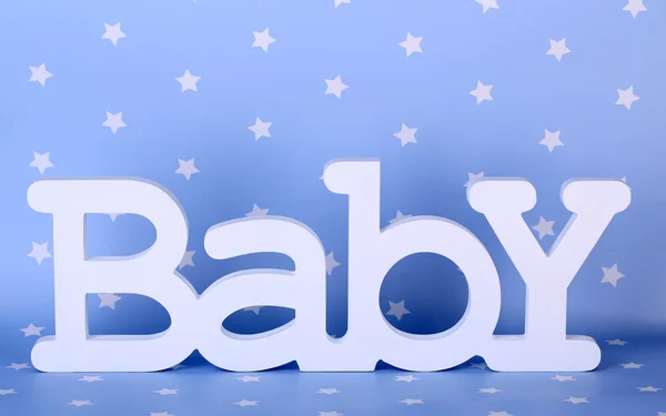 Word baby op blauwe achtergrond — Stockfoto