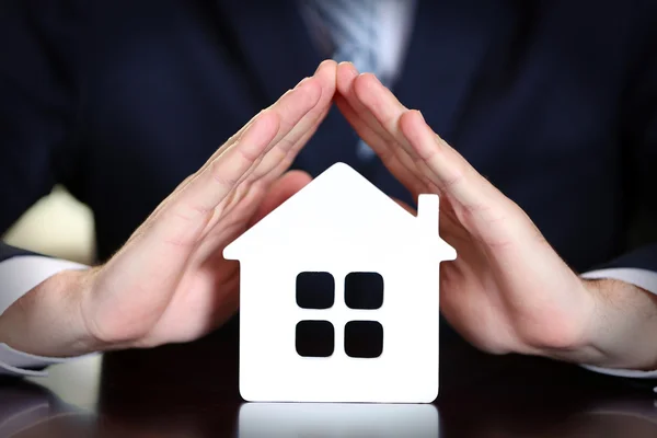 Male hands with model of house, closeup — Stock Photo, Image