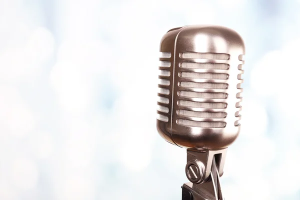 Retro microphone on bright blurred background — Stock Photo, Image