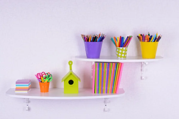 Shelves with stationery in child room close-up — Stock Photo, Image