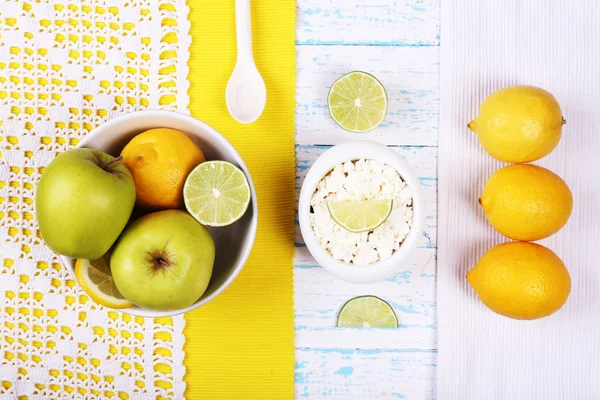 Apples, cottage cheese and lemons on wooden table top view — Stock Photo, Image