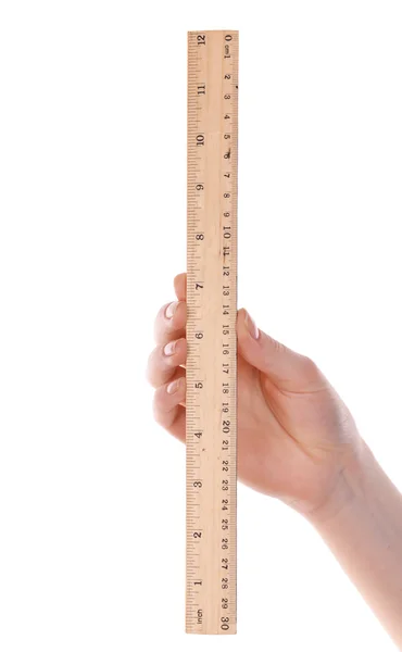 Female hand with wooden ruler isolated on white — Stock Photo, Image