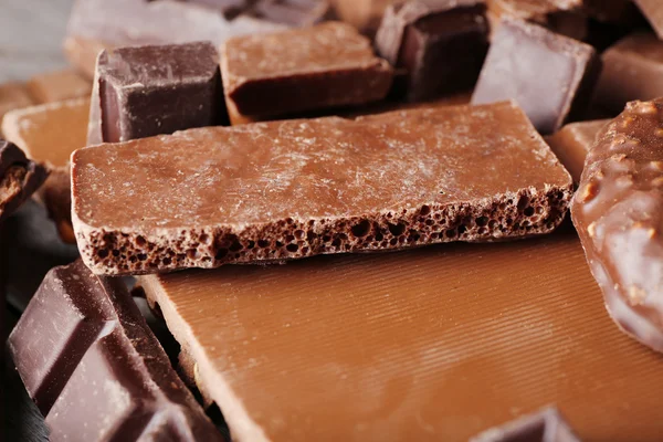 Set of chocolate on wooden table, closeup — Stock Photo, Image