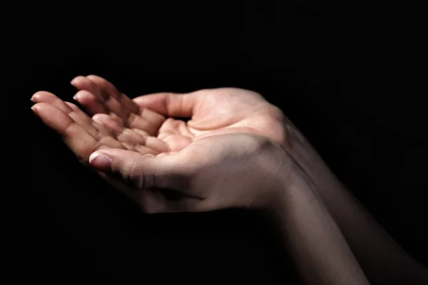 Woman praying in darkness Royalty Free Stock Images