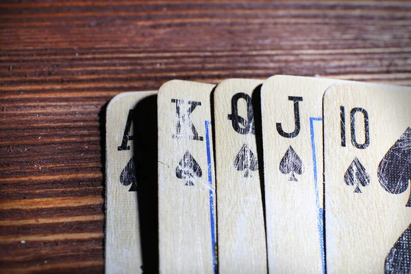 Playing cards on wooden table, closeup — Stock Photo, Image