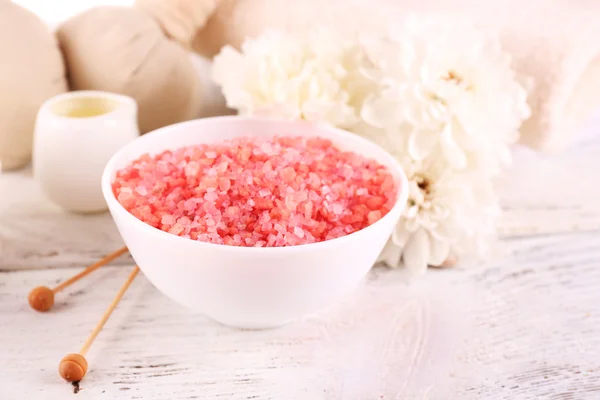 Spa still life with color sea salt on wooden table, closeup — Stock Photo, Image