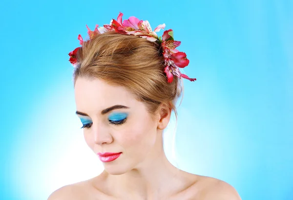 Young woman with flowers — Stock Photo, Image