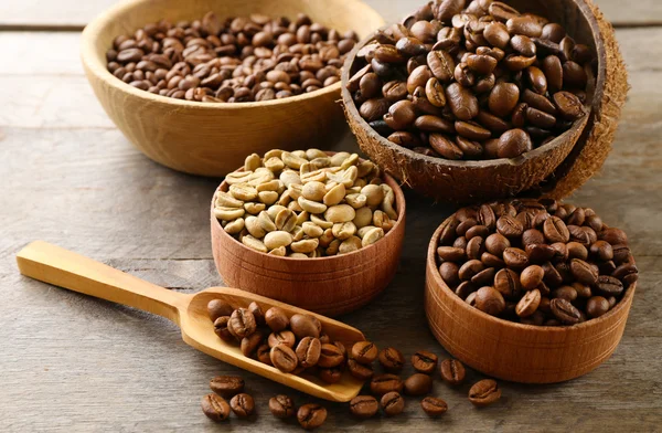 Various of coffee in small dishes on wooden table, closeup — Stock Photo, Image