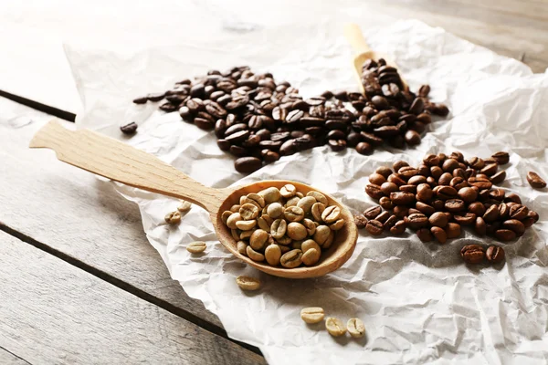 Coffee beans on crumpled parchment — Stock Photo, Image