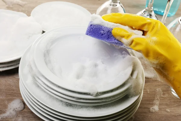 Female hand washing dish close up — Stock Photo, Image