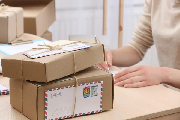 Cardboard boxes on work place in post office