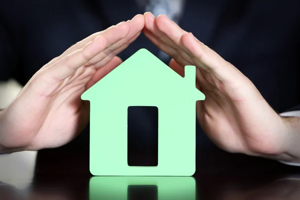 Male hands with model of house, closeup — Stock Photo, Image