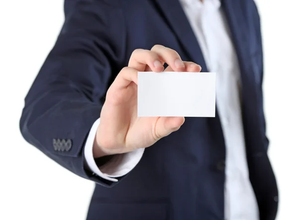 Elegante man in pak houden visitekaartje, geïsoleerd op wit — Stockfoto