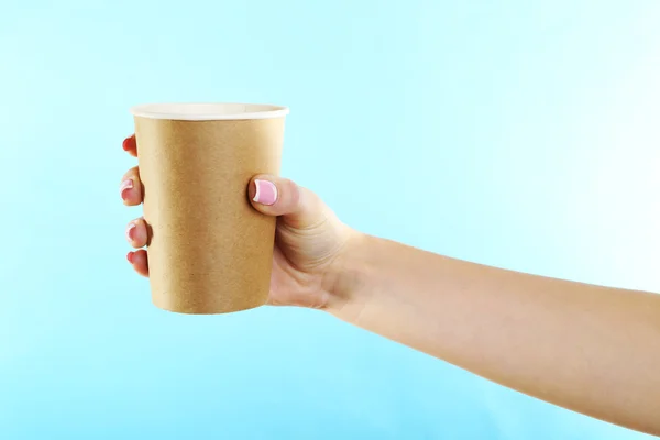 Female hand with paper cup — Stock Photo, Image