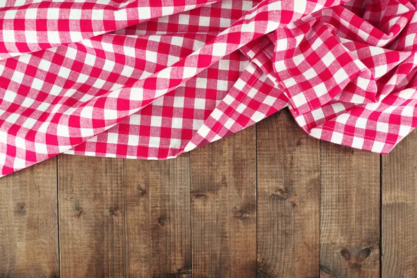 Checkered napkin on wooden table background — Stock Photo, Image